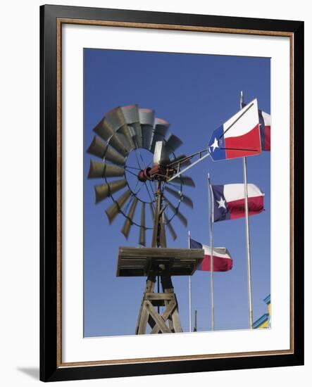 Old Water Pump and Texas State Flags, Amarillo, Texas-Walter Bibikow-Framed Photographic Print