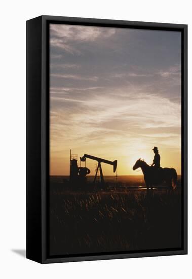 Old West, New West, Man Sitting on Horse with Oil Refinery at Sunset-David R^ Frazier-Framed Premier Image Canvas