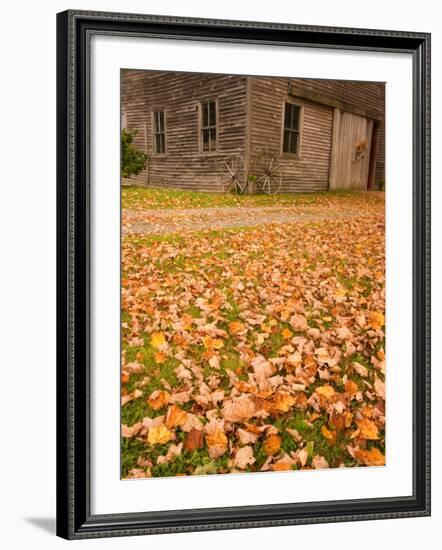 Old Wooden Barn with Wagon Wheels in Rural New England, Maine, USA-Joanne Wells-Framed Photographic Print