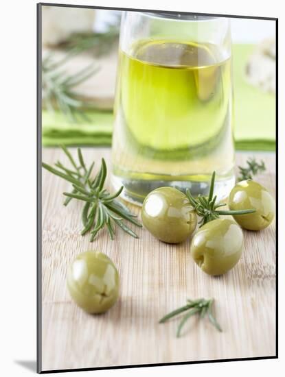 Olive Oil, Green Olives and Rosemary on Chopping Board-Jo Kirchherr-Mounted Photographic Print