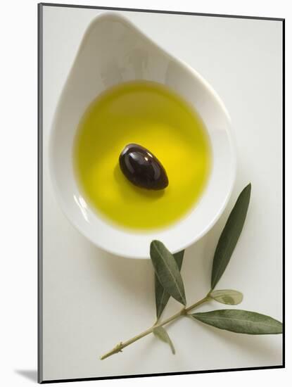 Olive Oil with Olive in Bowl, Olive Branch Beside It-null-Mounted Photographic Print