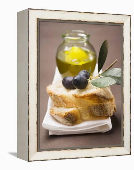 Olive Sprig with Black Olives on White Bread, Olive Oil Behind-null-Framed Premier Image Canvas