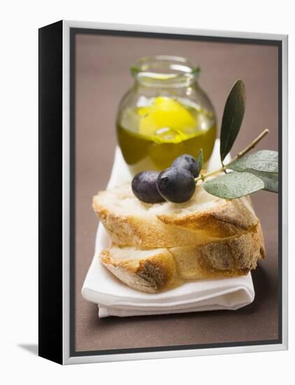 Olive Sprig with Black Olives on White Bread, Olive Oil Behind-null-Framed Premier Image Canvas