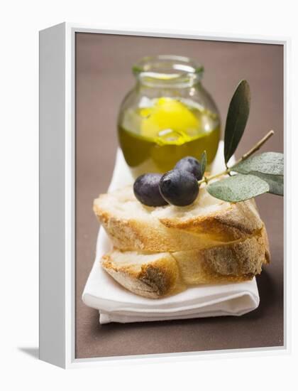 Olive Sprig with Black Olives on White Bread, Olive Oil Behind-null-Framed Premier Image Canvas