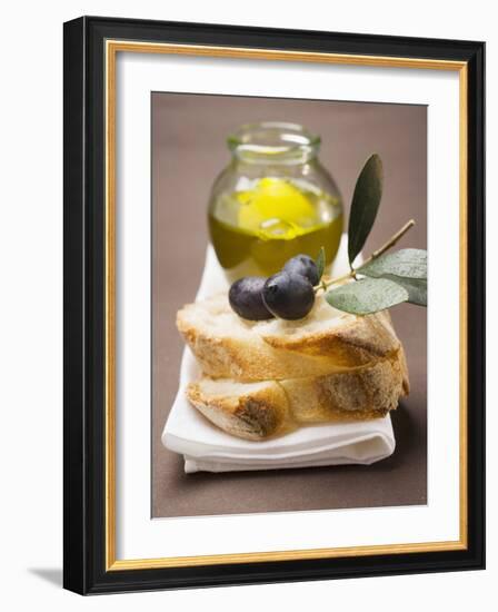 Olive Sprig with Black Olives on White Bread, Olive Oil Behind-null-Framed Premium Photographic Print