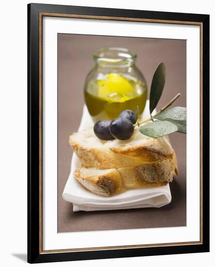 Olive Sprig with Black Olives on White Bread, Olive Oil Behind-null-Framed Photographic Print