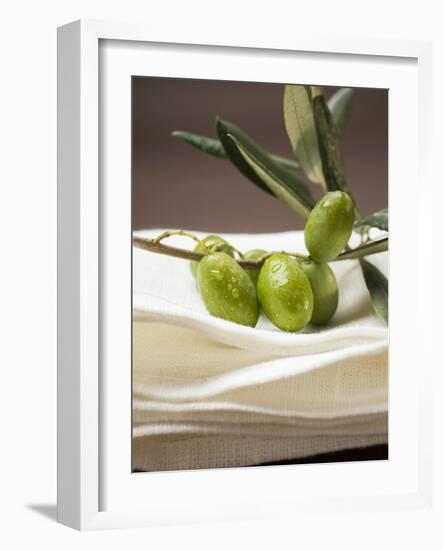 Olive Sprig with Green Olives on Linen Cloth-null-Framed Photographic Print