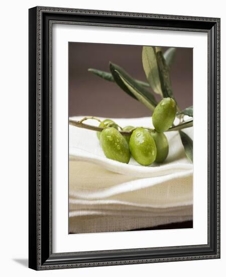 Olive Sprig with Green Olives on Linen Cloth-null-Framed Photographic Print