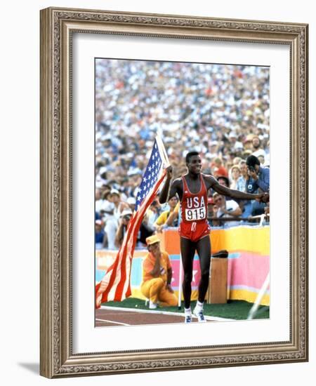 Olympic Games in Los Angeles, 1984 : 100M : Carl Lewis Winner-null-Framed Photo