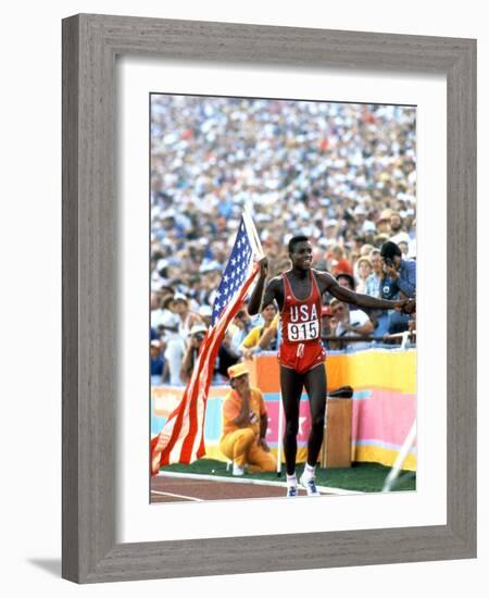 Olympic Games in Los Angeles, 1984 : 100M : Carl Lewis Winner-null-Framed Photo