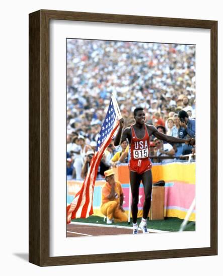 Olympic Games in Los Angeles, 1984 : 100M : Carl Lewis Winner-null-Framed Photo