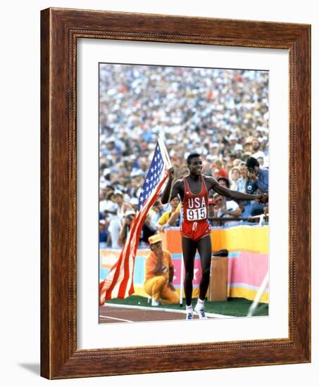 Olympic Games in Los Angeles, 1984 : 100M : Carl Lewis Winner-null-Framed Photo