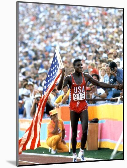Olympic Games in Los Angeles, 1984 : 100M : Carl Lewis Winner-null-Mounted Photo