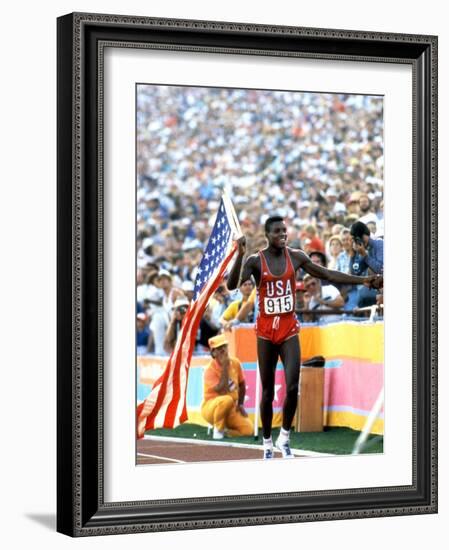 Olympic Games in Los Angeles, 1984 : 100M : Carl Lewis Winner-null-Framed Photo