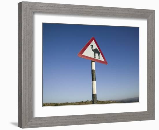 Oman, Dhofar Region, Salalah, Camel Crossing Sign in the Dhofar Mountains-Walter Bibikow-Framed Photographic Print