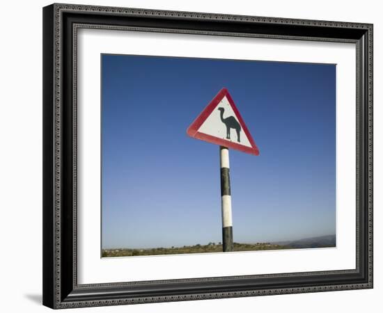 Oman, Dhofar Region, Salalah, Camel Crossing Sign in the Dhofar Mountains-Walter Bibikow-Framed Photographic Print