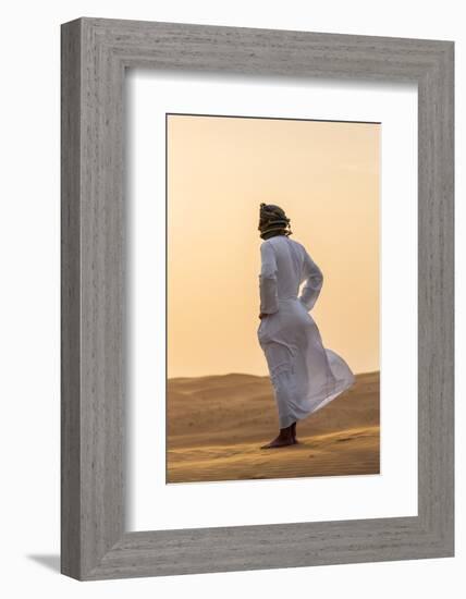 Oman, Wahiba Sands. an Omani Guide Enjoys the Sunset on Sand Dunes in Wahiba Sands.-Nigel Pavitt-Framed Photographic Print