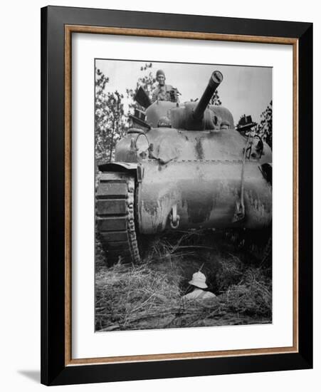 Oncoming View of Tank About to Pass over Foxhole in Which a Soldier is Crouched Down-Myron Davis-Framed Photographic Print