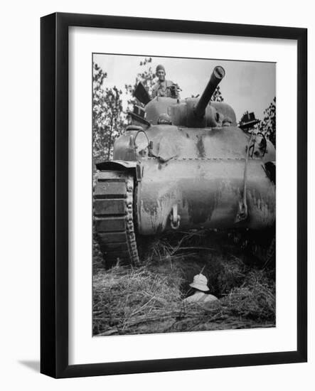 Oncoming View of Tank About to Pass over Foxhole in Which a Soldier is Crouched Down-Myron Davis-Framed Photographic Print