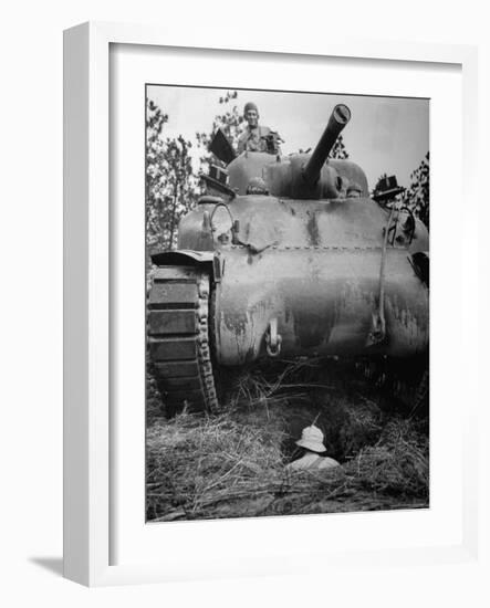 Oncoming View of Tank About to Pass over Foxhole in Which a Soldier is Crouched Down-Myron Davis-Framed Photographic Print