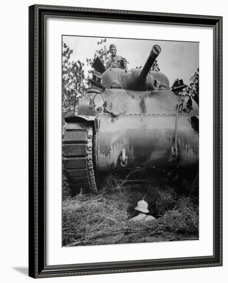 Oncoming View of Tank About to Pass over Foxhole in Which a Soldier is Crouched Down-Myron Davis-Framed Photographic Print