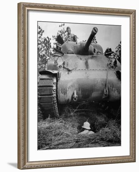 Oncoming View of Tank About to Pass over Foxhole in Which a Soldier is Crouched Down-Myron Davis-Framed Photographic Print