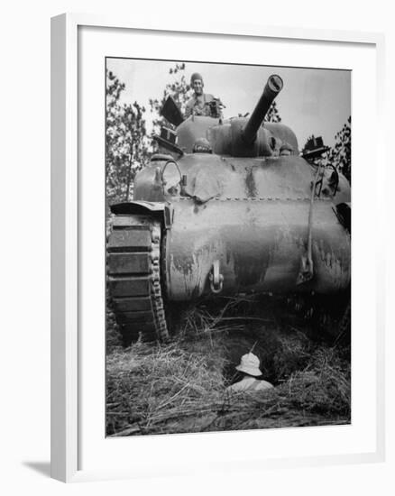 Oncoming View of Tank About to Pass over Foxhole in Which a Soldier is Crouched Down-Myron Davis-Framed Photographic Print