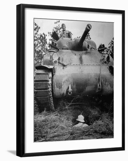 Oncoming View of Tank About to Pass over Foxhole in Which a Soldier is Crouched Down-Myron Davis-Framed Photographic Print