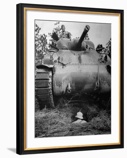 Oncoming View of Tank About to Pass over Foxhole in Which a Soldier is Crouched Down-Myron Davis-Framed Photographic Print