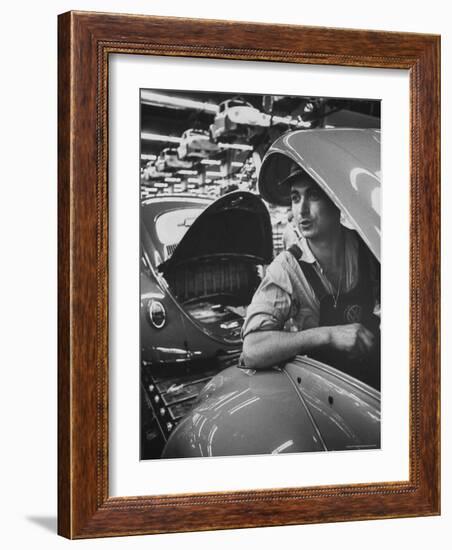 One of Many Italian Immigrants Working in Volkswagen Plant-Paul Schutzer-Framed Photographic Print