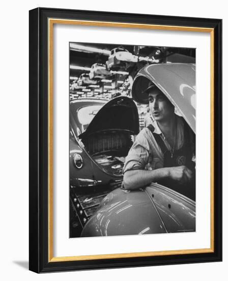 One of Many Italian Immigrants Working in Volkswagen Plant-Paul Schutzer-Framed Photographic Print