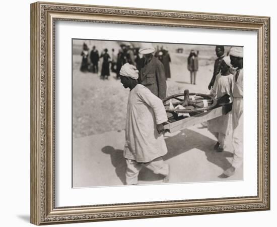 One of the Chariot Wheels Being Removed from the Tomb of Tutankhamun, Valley of the Kings, 1922-Harry Burton-Framed Photographic Print