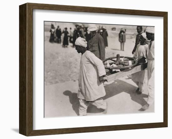 One of the Chariot Wheels Being Removed from the Tomb of Tutankhamun, Valley of the Kings, 1922-Harry Burton-Framed Photographic Print