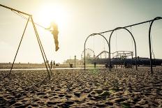 Santa Monica Beach. Silhouette of a Woman Going up with the Swing. Concept about Traveling,United S-Oneinchpunch-Photographic Print