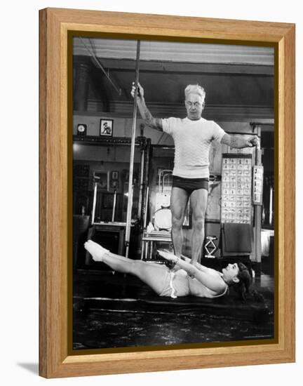 Opera Singer Roberta Peters Balancing Her Trainer, Joseph Pilates, on Her Operatic Breadbasket-Michael Rougier-Framed Premier Image Canvas