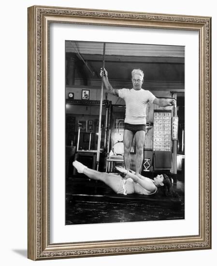 Opera Singer Roberta Peters Balancing Her Trainer, Joseph Pilates, on Her Operatic Breadbasket-Michael Rougier-Framed Premium Photographic Print