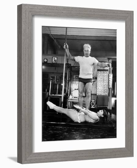 Opera Singer Roberta Peters Balancing Her Trainer, Joseph Pilates, on Her Operatic Breadbasket-Michael Rougier-Framed Premium Photographic Print