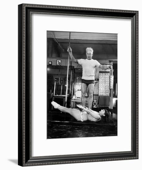 Opera Singer Roberta Peters Balancing Her Trainer, Joseph Pilates, on Her Operatic Breadbasket-Michael Rougier-Framed Premium Photographic Print