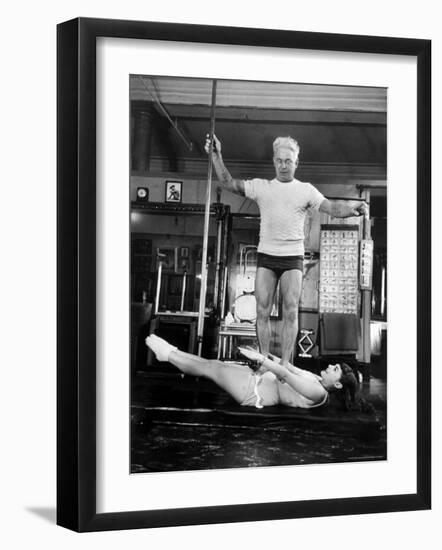 Opera Singer Roberta Peters Balancing Her Trainer, Joseph Pilates, on Her Operatic Breadbasket-Michael Rougier-Framed Premium Photographic Print