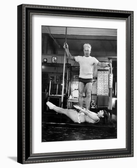 Opera Singer Roberta Peters Balancing Her Trainer, Joseph Pilates, on Her Operatic Breadbasket-Michael Rougier-Framed Premium Photographic Print