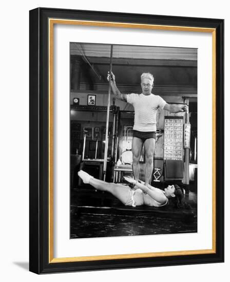 Opera Singer Roberta Peters Balancing Her Trainer, Joseph Pilates, on Her Operatic Breadbasket-Michael Rougier-Framed Premium Photographic Print