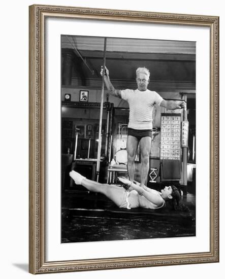 Opera Singer Roberta Peters Balancing Her Trainer, Joseph Pilates, on Her Operatic Breadbasket-Michael Rougier-Framed Premium Photographic Print