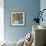 Orange Daisies In Blue Vase-Jane Slivka-Framed Art Print displayed on a wall