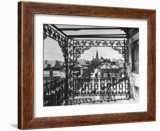 Orleans Street, Center of Old French Quarter of City, Through Grillwork of a Balcony-Andreas Feininger-Framed Photographic Print