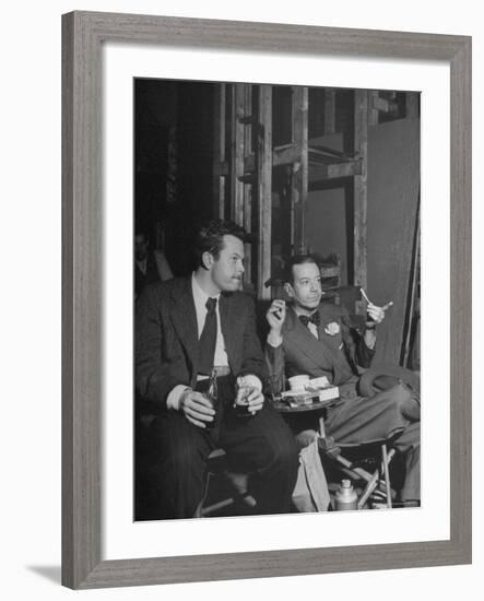 Orson Welles and Cole Porter Discussing the Stage Production of "Around the World in 80 Days"-Al Fenn-Framed Premium Photographic Print