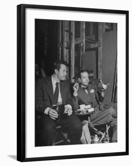 Orson Welles and Cole Porter Discussing the Stage Production of "Around the World in 80 Days"-Al Fenn-Framed Premium Photographic Print