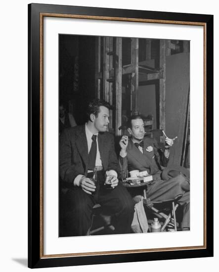 Orson Welles and Cole Porter Discussing the Stage Production of "Around the World in 80 Days"-Al Fenn-Framed Premium Photographic Print