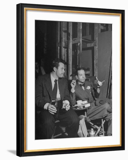 Orson Welles and Cole Porter Discussing the Stage Production of "Around the World in 80 Days"-Al Fenn-Framed Premium Photographic Print