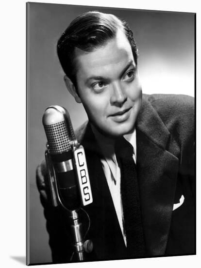 Orson Welles at the CBS Microphone in Publicity Shot for Murcury Summer Theater, 1946-null-Mounted Photo