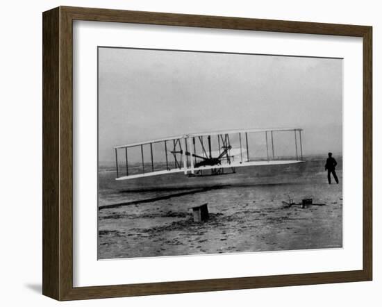 Orville Wright Taking Plane For 1st Motorized Flight as Brother Wilbur Wright Looks at Kitty Hawk-null-Framed Photographic Print